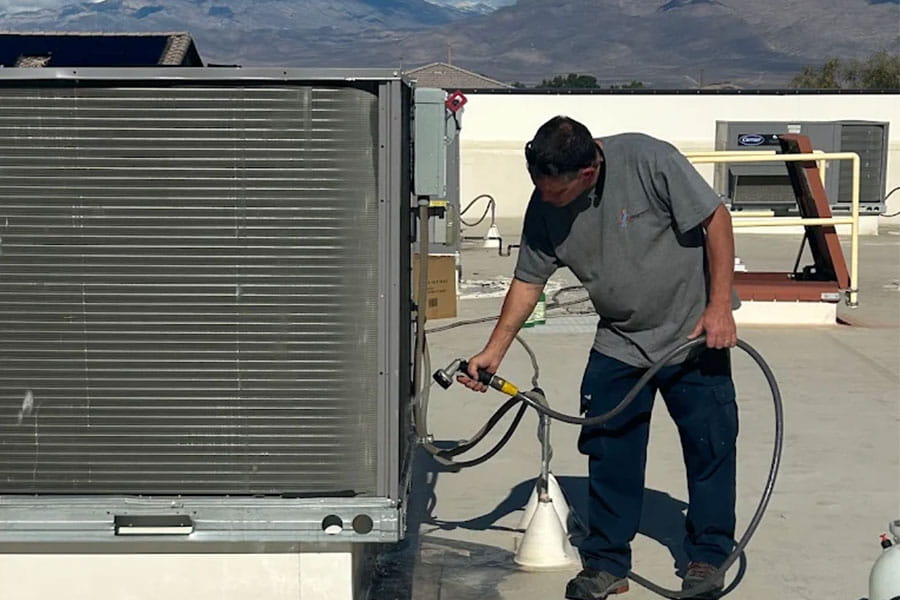 32 Degrees HVAC technician servicing rooftop unit in Las Vegas, NV