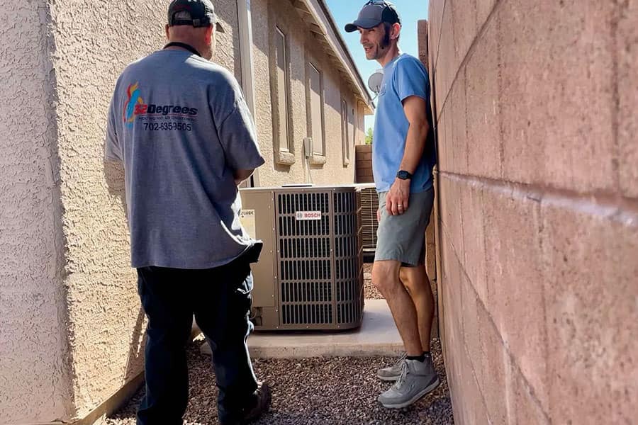 32 Degrees technician discussing AC service