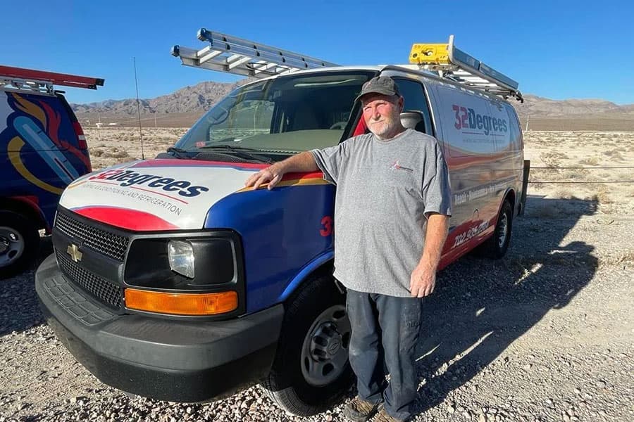 32 Degrees technician beside service van in Las Vegas