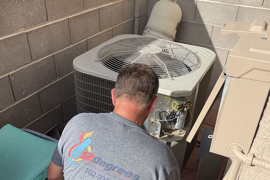 32 Degrees technician repairing AC compressor in Las Vegas