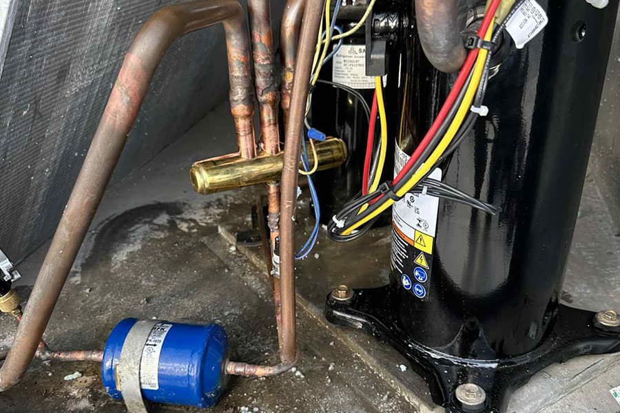 AC compressor components checked during repair service in Las Vegas NV