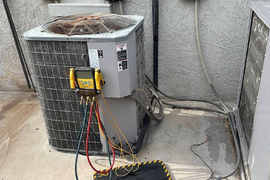 AC tune up gauges connected to outdoor unit in Las Vegas, NV