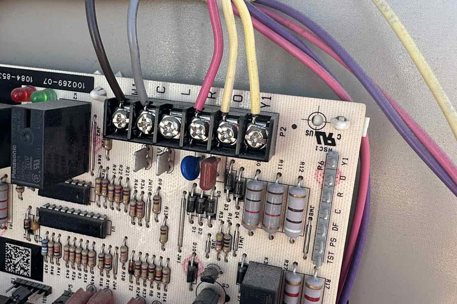 Heat pump electrical components inspected during maintenance service in Las Vegas NV