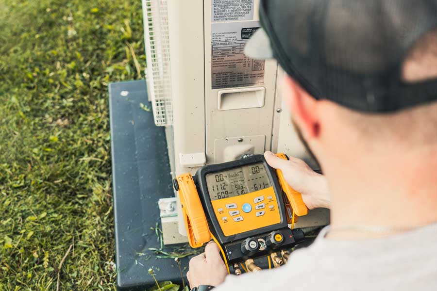 32 Degrees technician repairing outdoor mini split unit in Las Vegas, NV