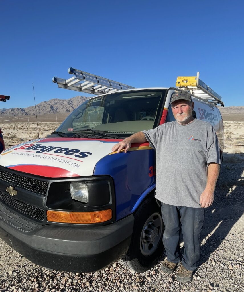 Andy standing beside a 32 Degrees service van.